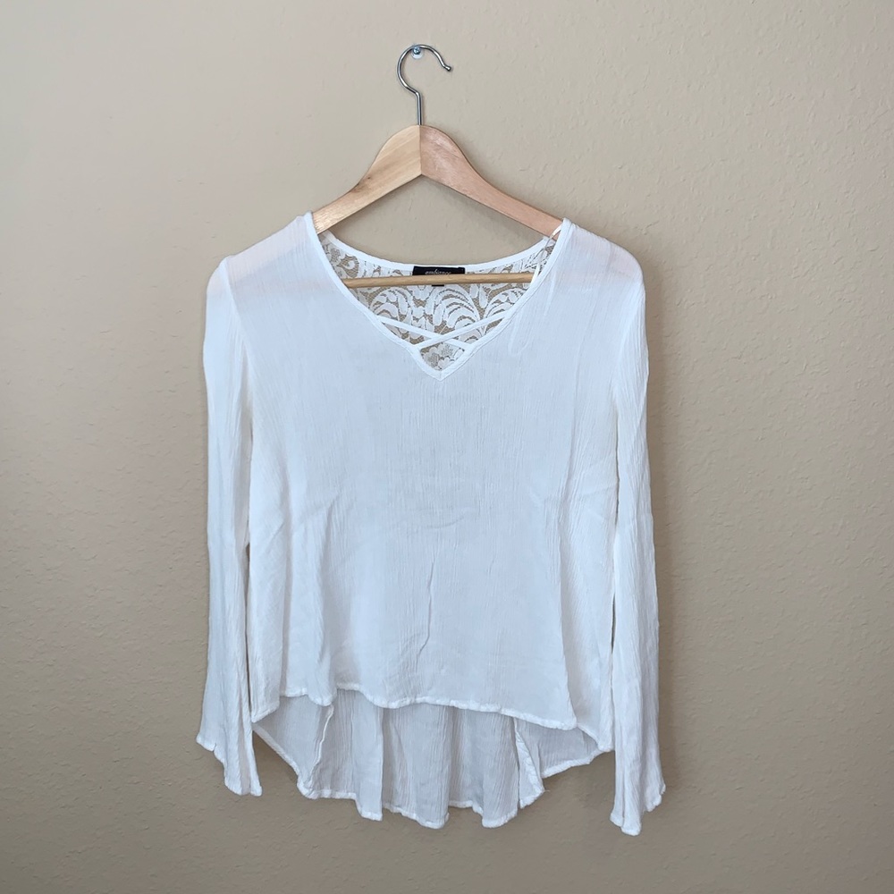 A blouse like top with lace design in the back.